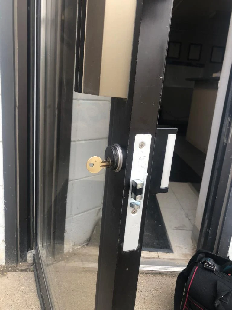 Storefront door lock and latch