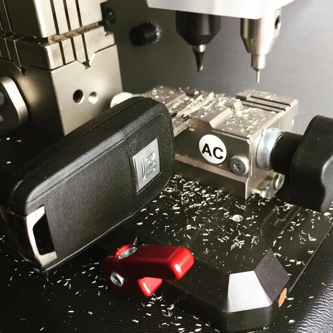 Car key in a key cutting machine